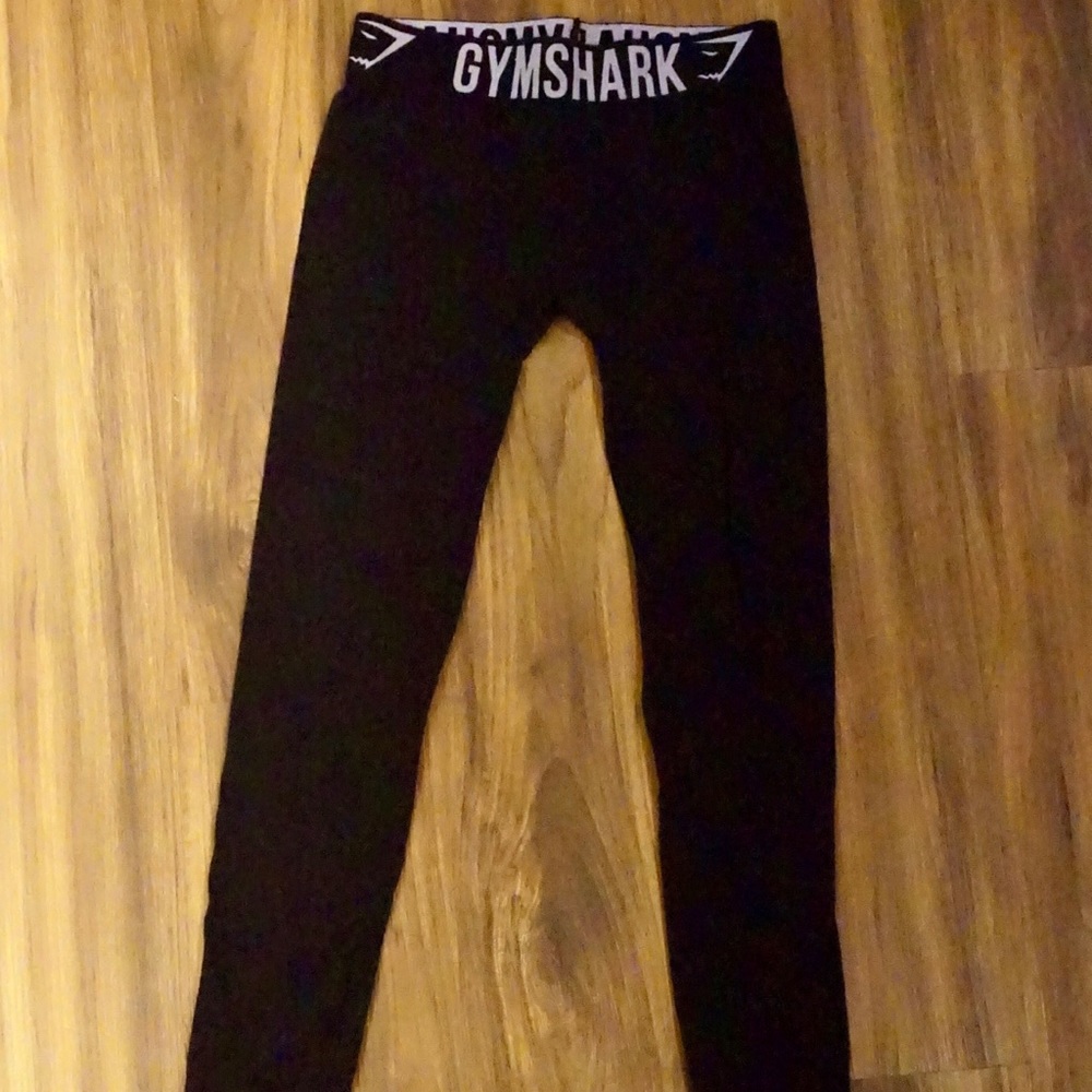 XS black Gymshark leggings with lavender colored lettering on waistband